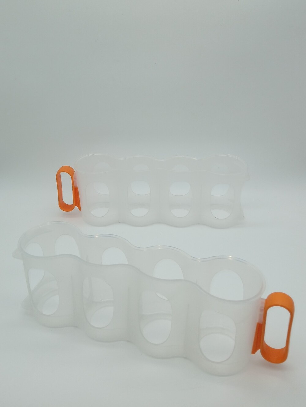 Clear Silicone Egg or Bottle Holder with Orange Handles Set Of 2